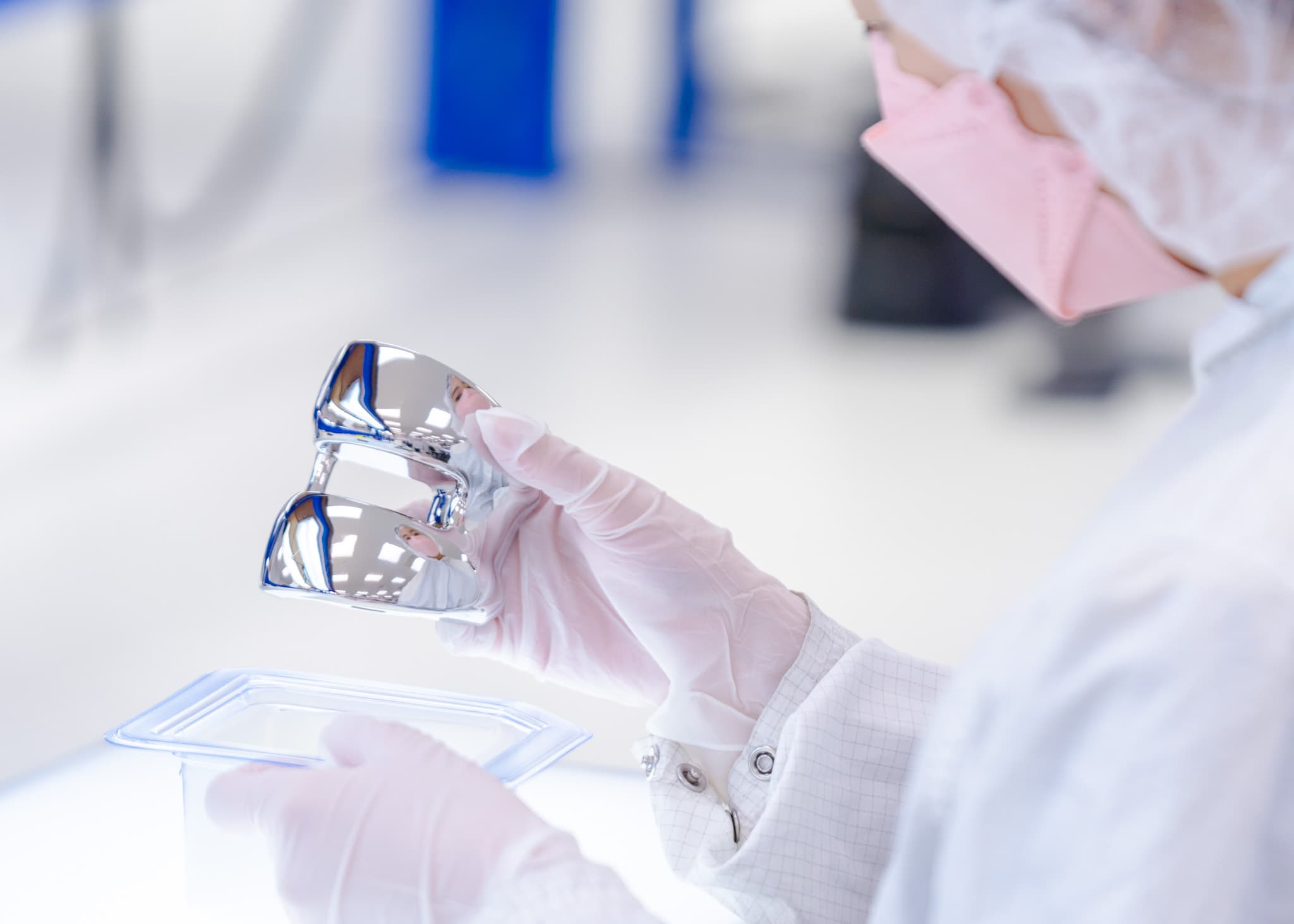 Lab Technician Inspecting Medical Device Component | Life Science Outsourcing