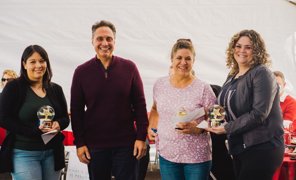 Employees of the Year, Denise Contreras, Cristina Serna, and Minerva Paez with CEO John Nino