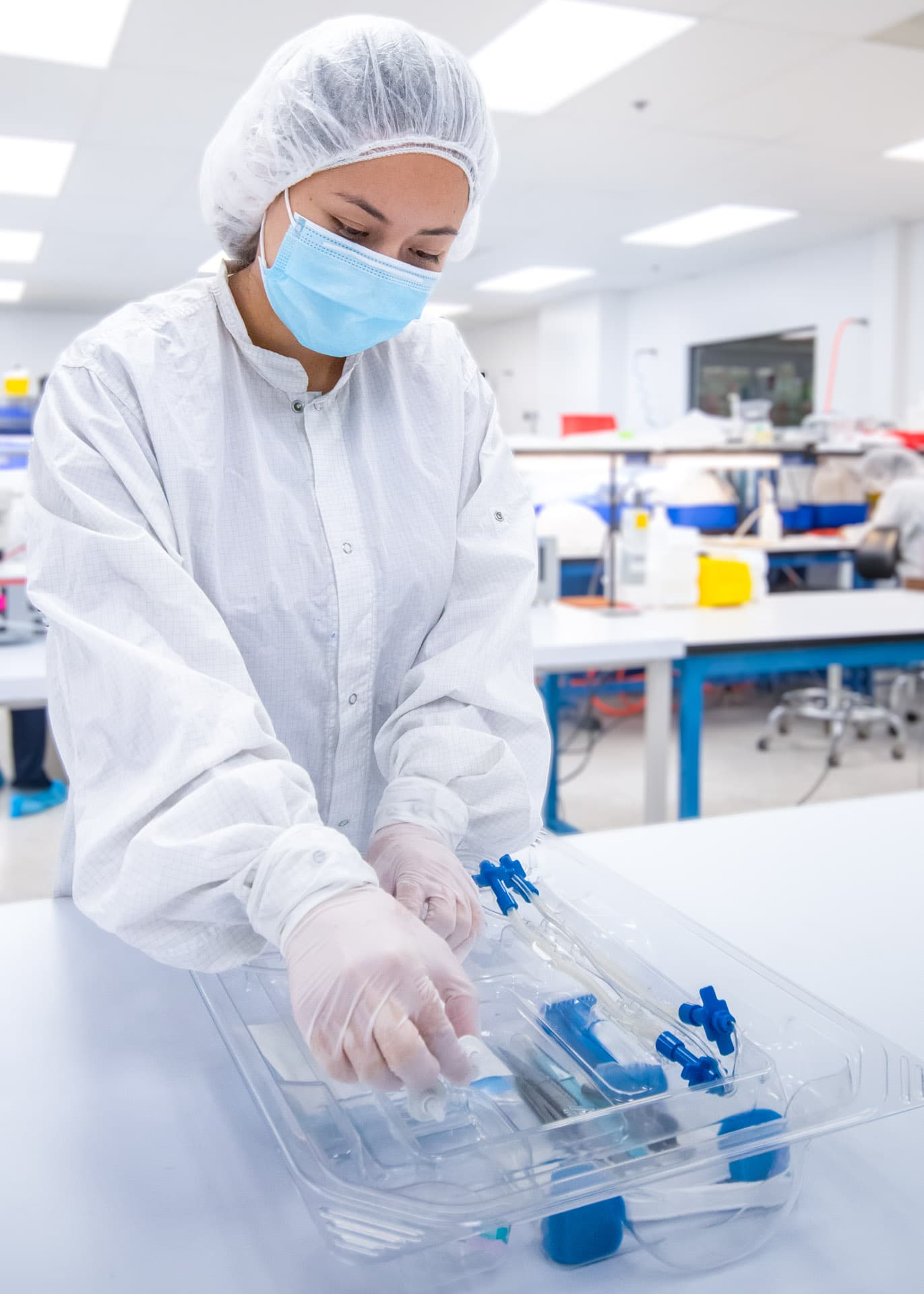 Technician Assembling Fluid Management Device in Cleanroom – LSO