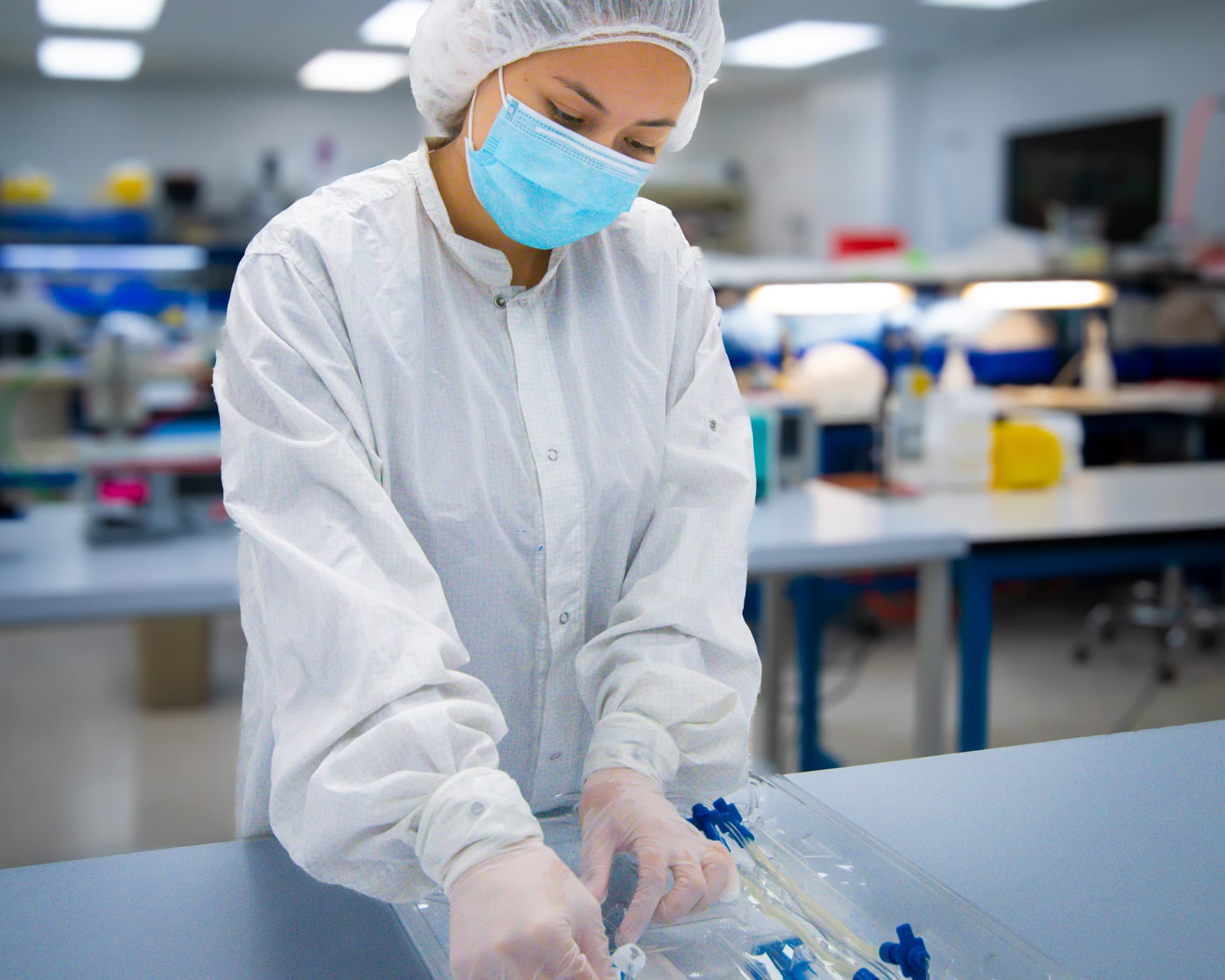 Technician Assembling Fluid Management Device in Cleanroom – LSO